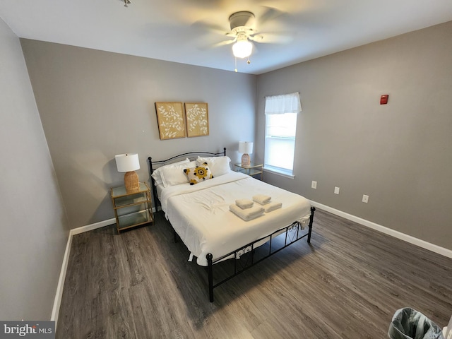 bedroom with ceiling fan and dark wood-type flooring