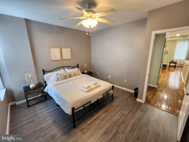 bedroom featuring ceiling fan and dark hardwood / wood-style floors