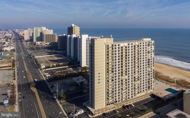 aerial view featuring a water view and a view of the beach