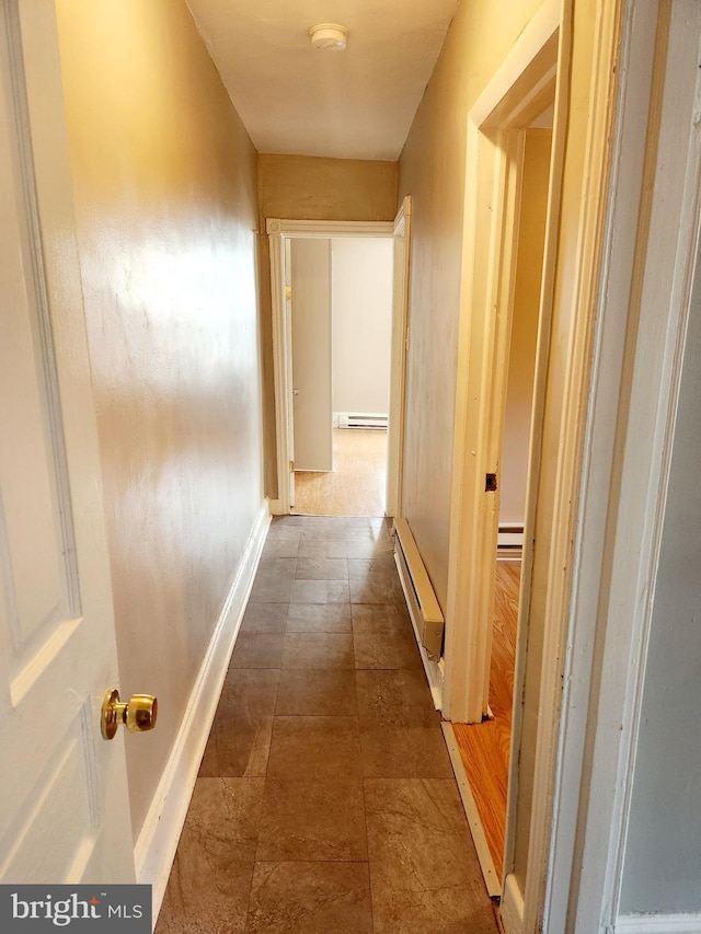 corridor with baseboard heating