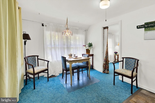 dining room with plenty of natural light and an inviting chandelier