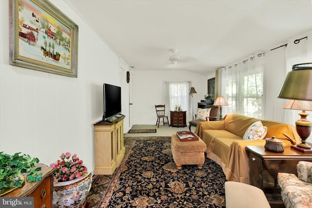 carpeted living room featuring ceiling fan