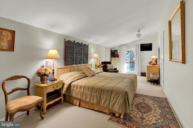 carpeted bedroom featuring lofted ceiling