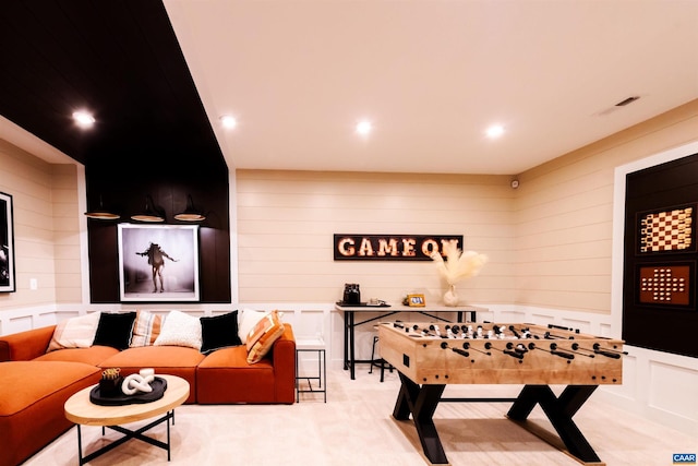 game room featuring light carpet