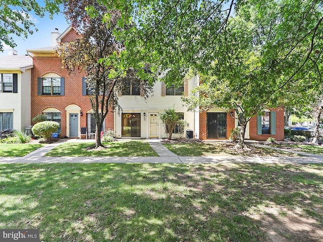 view of property featuring a front yard