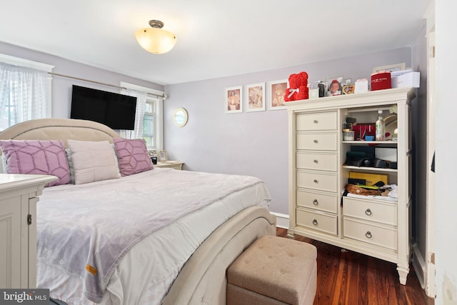 bedroom featuring dark wood-type flooring