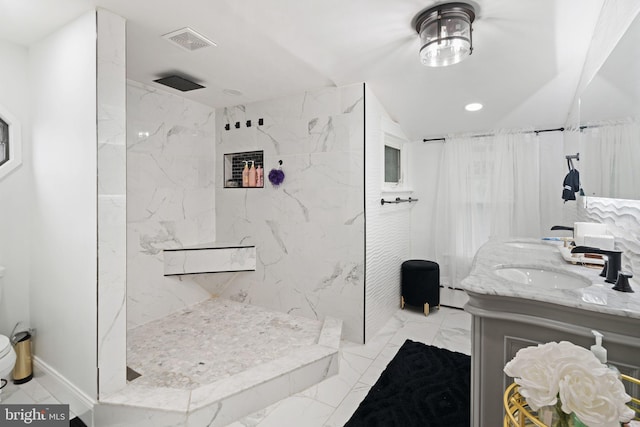 bathroom with walk in shower, vanity, and a baseboard heating unit