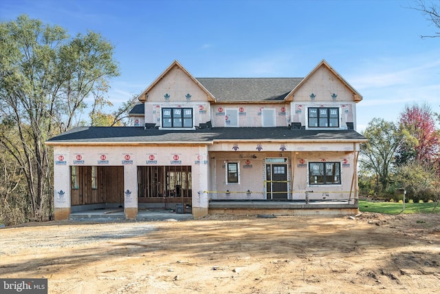 property in mid-construction with covered porch