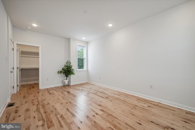 unfurnished room with light hardwood / wood-style flooring