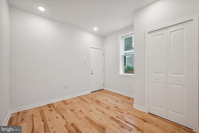 spare room with wood-type flooring