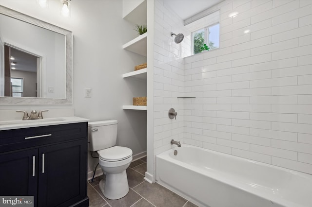 full bathroom with toilet, tiled shower / bath combo, tile patterned floors, and vanity