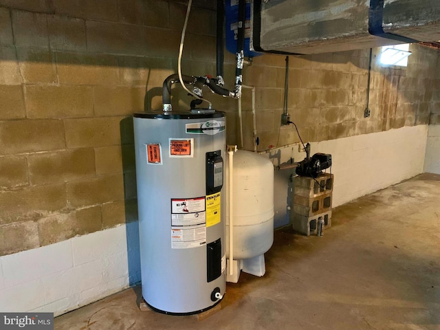 utility room with electric water heater