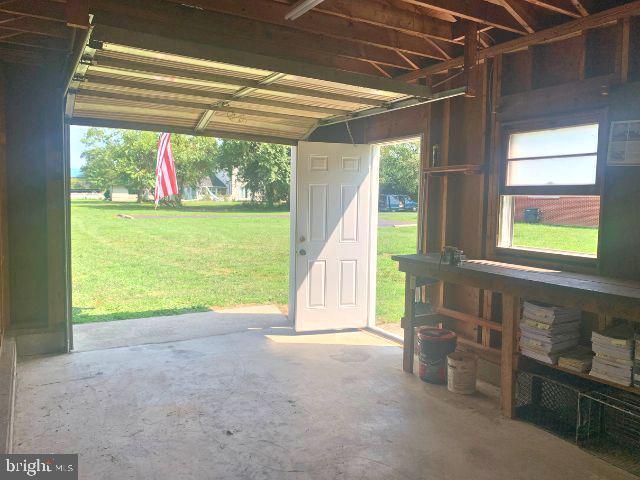 garage featuring a yard