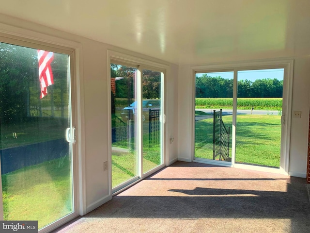 unfurnished sunroom featuring a wealth of natural light