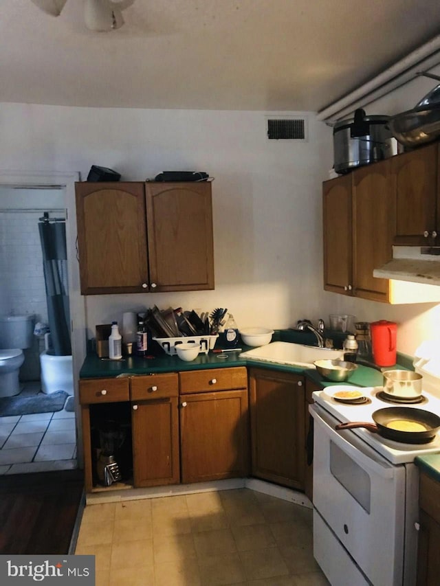 kitchen with sink and white range with electric stovetop