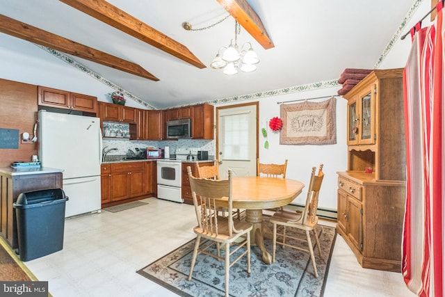 dining area featuring lofted ceiling with beams and a notable chandelier