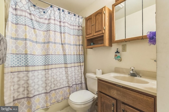 full bathroom with shower / bathtub combination with curtain, vanity, and toilet