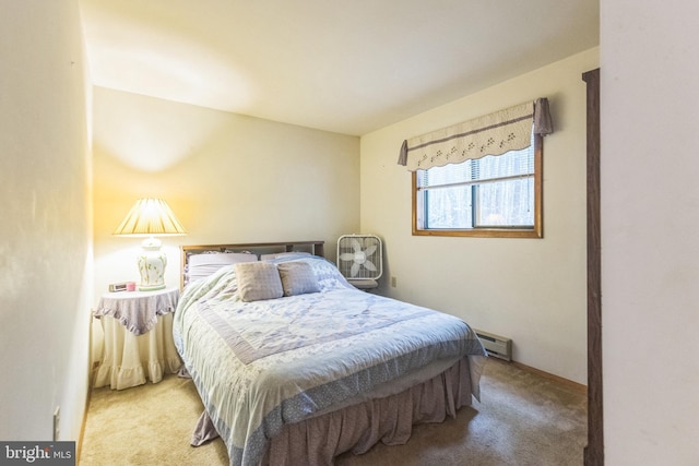 bedroom with carpet flooring and a baseboard radiator