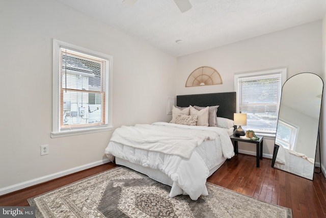 bedroom featuring ceiling fan and dark hardwood / wood-style flooring