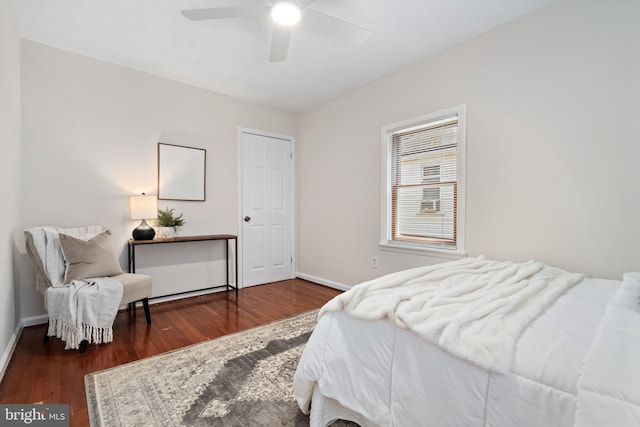 bedroom featuring ceiling fan and dark hardwood / wood-style floors