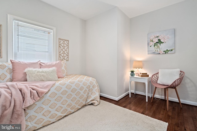 bedroom with dark wood-type flooring