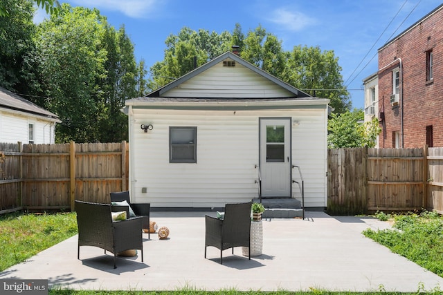 rear view of property with a patio