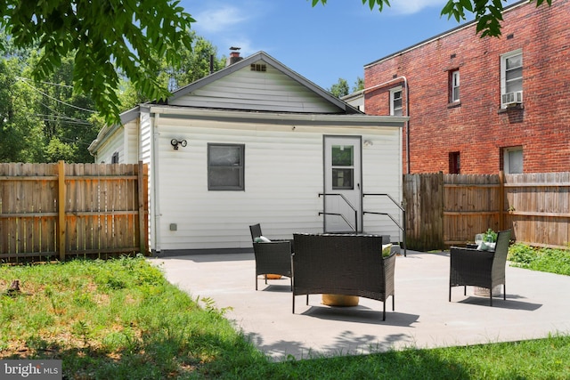 back of property featuring a patio area and cooling unit