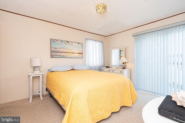 carpeted bedroom featuring a textured ceiling