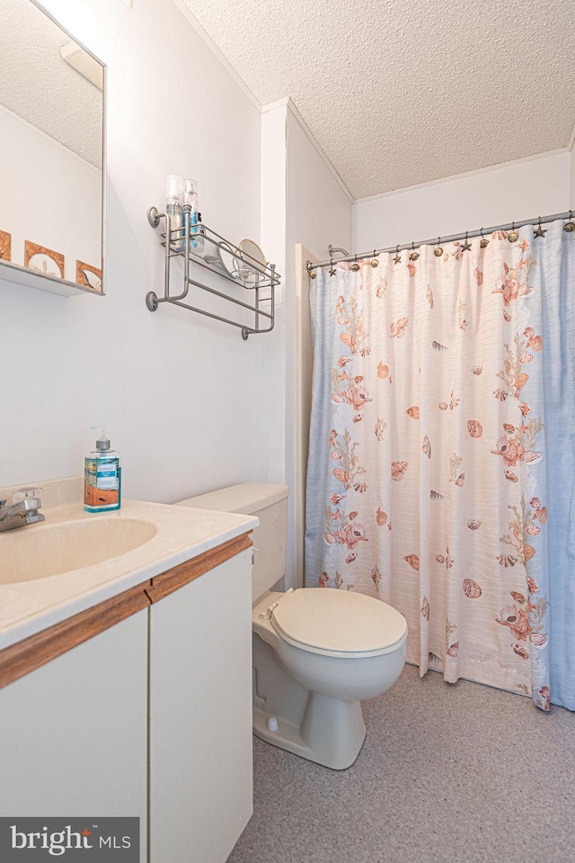 bathroom with vanity, a shower with curtain, a textured ceiling, and toilet