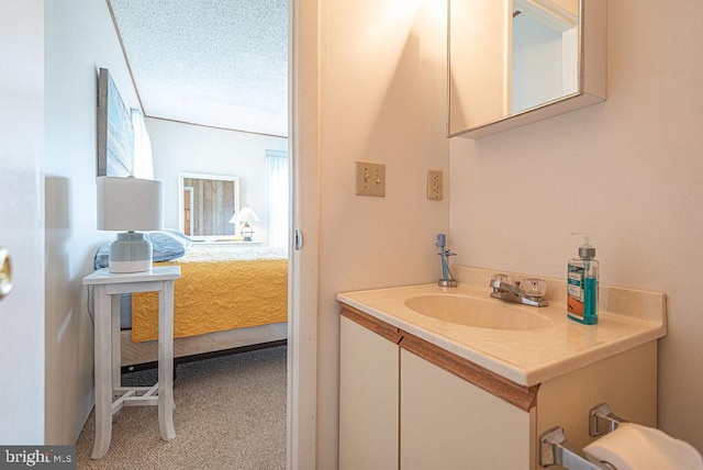 bathroom featuring vanity and a textured ceiling