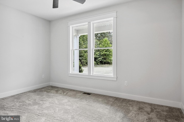 spare room with light carpet and ceiling fan