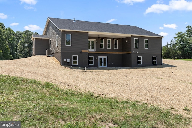 rear view of property with french doors and cooling unit