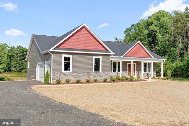 craftsman house featuring a porch and a garage