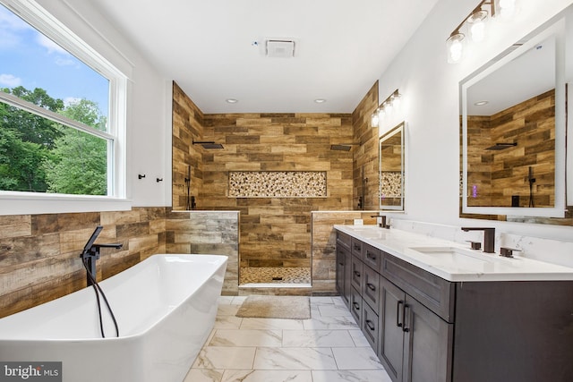 bathroom featuring vanity and plus walk in shower