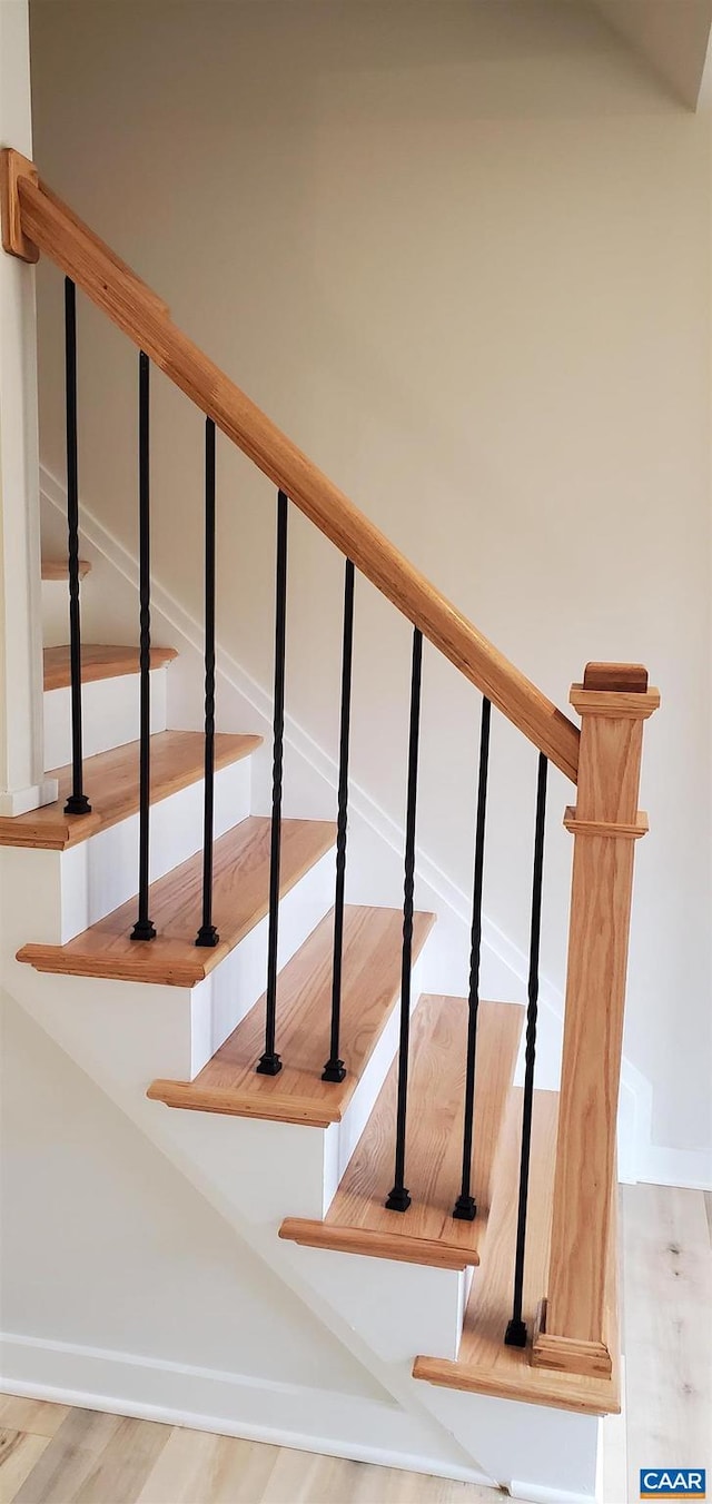 stairway with wood-type flooring