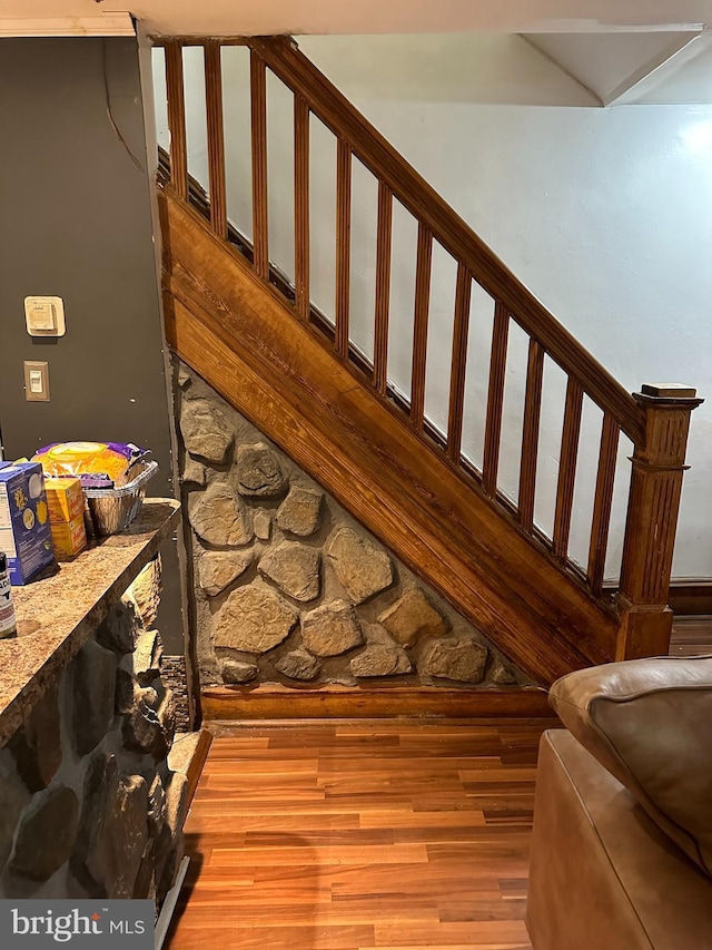 stairs with hardwood / wood-style flooring