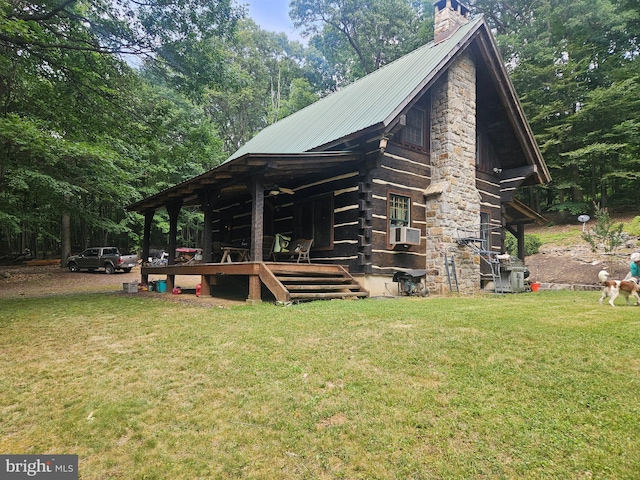 view of side of property with cooling unit and a lawn