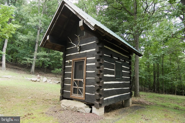 view of outbuilding featuring a yard