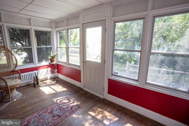 sunroom with radiator heating unit