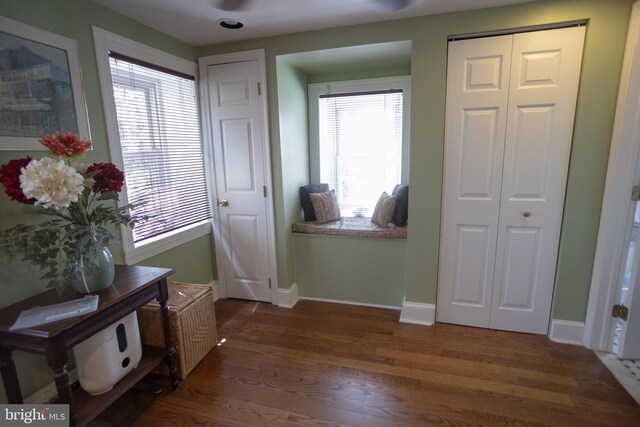 interior space with dark hardwood / wood-style flooring