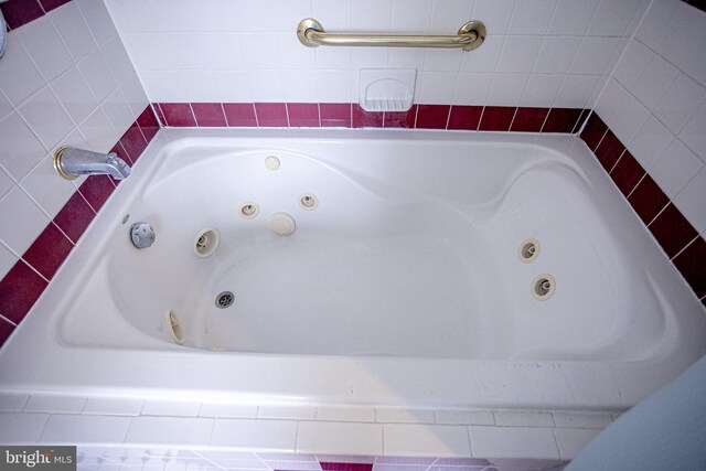 bathroom featuring a relaxing tiled tub