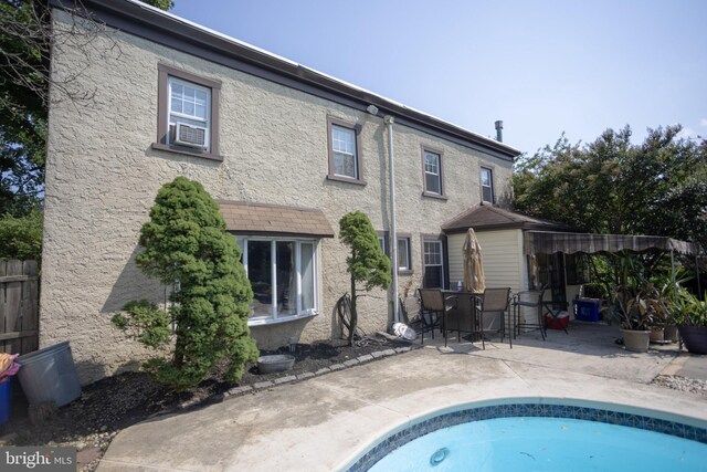 rear view of house with a patio