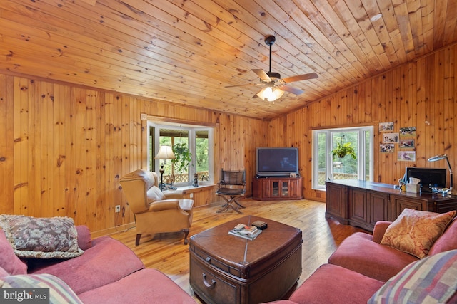 living room featuring lofted ceiling, a healthy amount of sunlight, wood ceiling, and light hardwood / wood-style floors