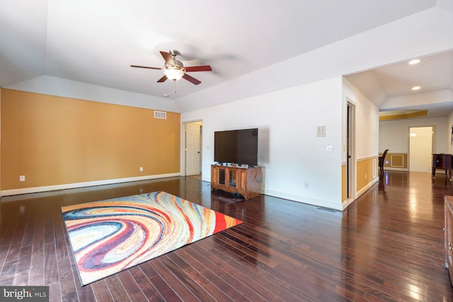 interior space with vaulted ceiling, dark hardwood / wood-style flooring, and ceiling fan