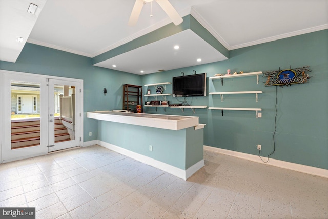 kitchen with crown molding, kitchen peninsula, french doors, and ceiling fan