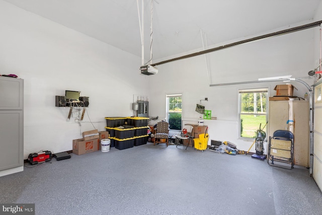 garage featuring electric panel and a garage door opener