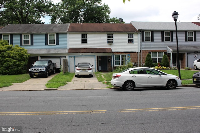 multi unit property featuring a garage