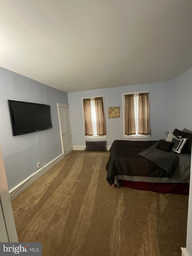 carpeted bedroom featuring radiator heating unit