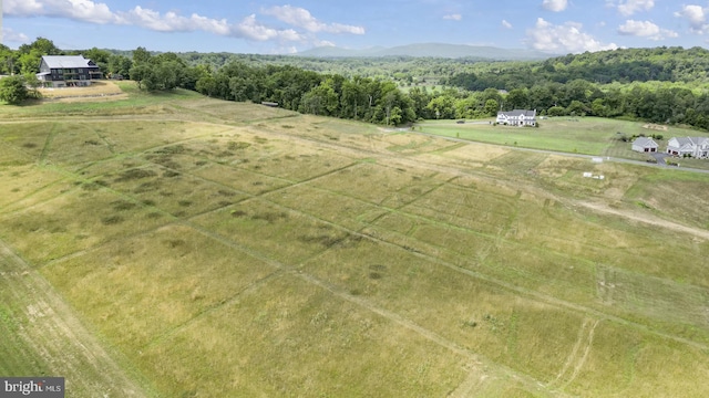 birds eye view of property featuring a rural view