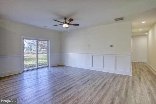 unfurnished room with light hardwood / wood-style floors and ceiling fan